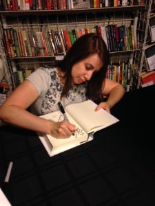 Jenny Milchman signing my copy of As Night Falls at Once Upon A Crime bookstore in Minneapolis.